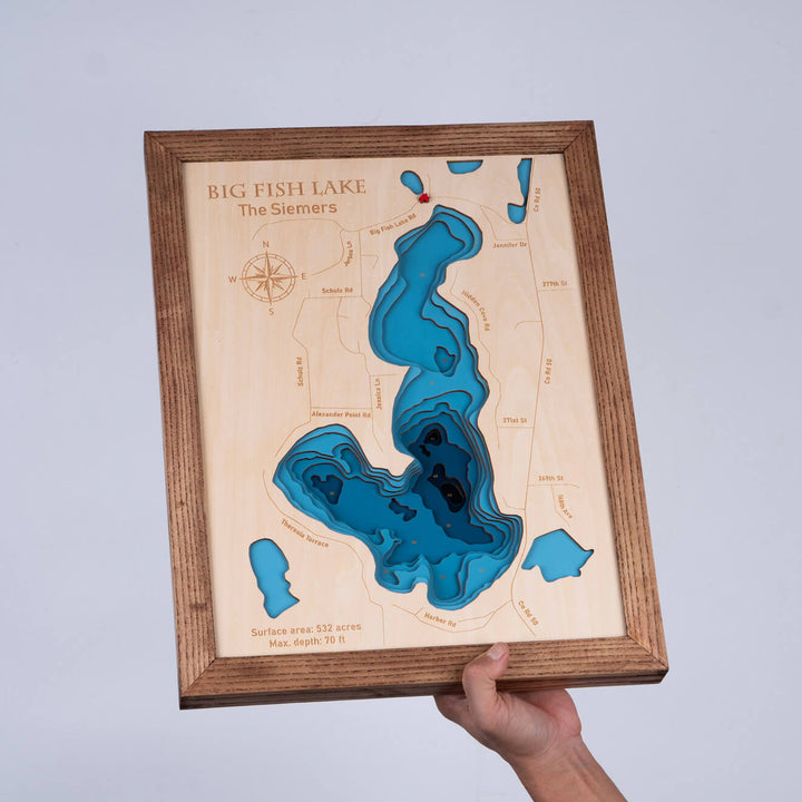 Hand holding a Custom 3D Wooden Map of Big Fish Lake, showcasing intricate topographic details, by Moc Tho