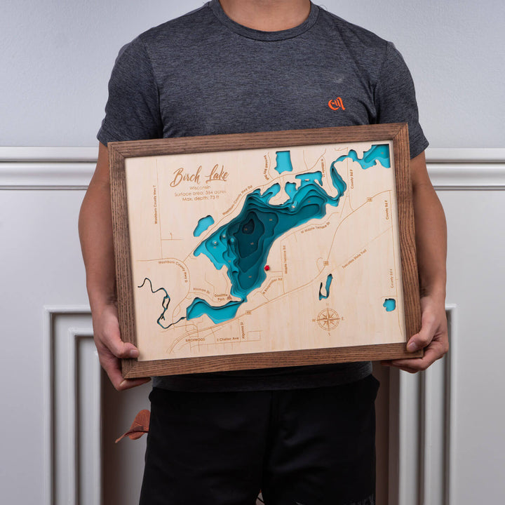 Person holding a Custom 3D Wooden Map of Birch Lake, perfect for home decor by Moc Tho