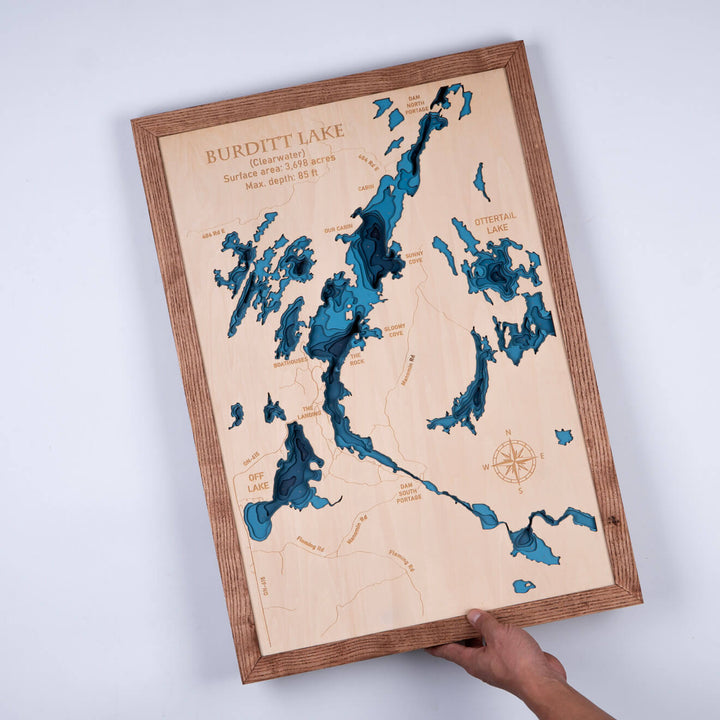 Person holding a 3D Wooden Burditt Lake Map, showcasing detailed topography, a unique piece of wall art by Moc Tho