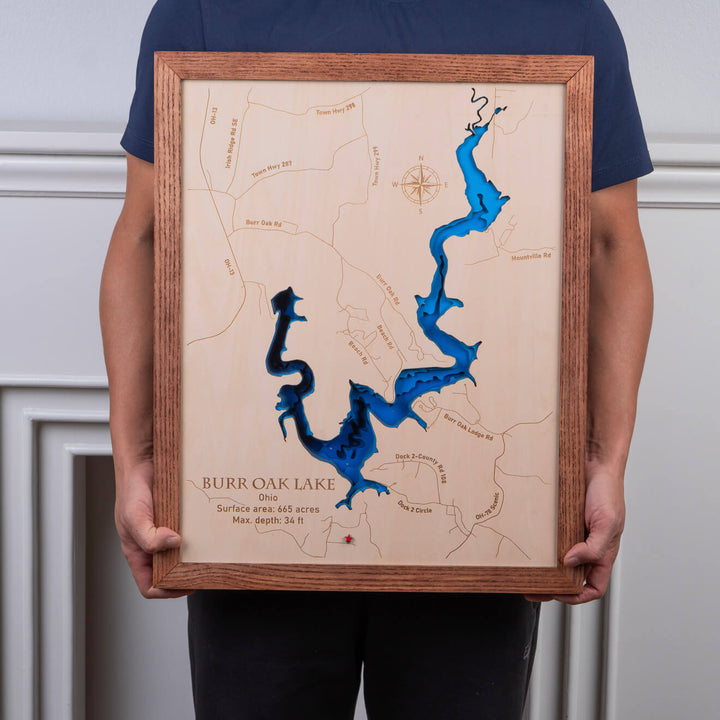 Person holding a 3D Wooden Burr Oak Map with blue water accents, a unique piece by Moc Tho